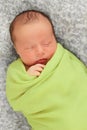 Newborn baby in green Royalty Free Stock Photo