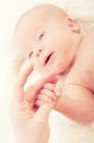 Newborn baby hand on the finger of mother Royalty Free Stock Photo