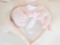 Newborn Baby Hand reaching for an adult hand - close-up Royalty Free Stock Photo