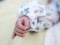 Newborn baby hand with small fingers, Caucasian infant, close-up view