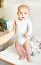 Newborn baby held up stand up thighs Royalty Free Stock Photo