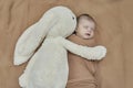 Newborn baby girl with her bunny Royalty Free Stock Photo