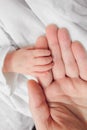 Newborn baby holding father finger Royalty Free Stock Photo