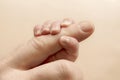 Newborn baby holding his hand on the fingers of parents Royalty Free Stock Photo