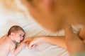 Newborn baby holding his mother`s hands tenderly Royalty Free Stock Photo