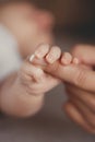 Newborn baby holding mother's finger Royalty Free Stock Photo