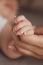 Newborn baby holding mother's finger Royalty Free Stock Photo