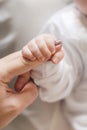 Newborn baby holding mother's finger Royalty Free Stock Photo