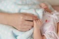 Newborn Baby Holding Mothers Hand