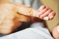 Newborn baby holding parents finger Royalty Free Stock Photo