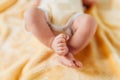 Newborn baby, legs close-up, lying on a soft blanket Royalty Free Stock Photo