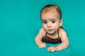Newborn baby. A little boy in brown bodysuit . Beautiful portrait of a toddler. Big-eyed baby. Royalty Free Stock Photo