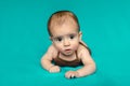 Newborn baby. A little boy in brown bodysuit . Beautiful portrait of a toddler. Big-eyed baby. Royalty Free Stock Photo