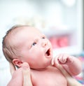 Newborn baby with look of wonderment