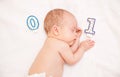 Newborn baby lying in bed Royalty Free Stock Photo