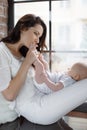 Newborn baby lying on his mother`s lap Royalty Free Stock Photo