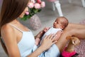 Newborn baby lying on his mother`s lap Royalty Free Stock Photo