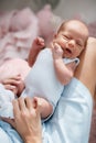 Newborn baby lying on his mother`s lap Royalty Free Stock Photo