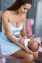 Newborn baby lying on his mother`s lap Royalty Free Stock Photo