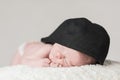 Newborn Baby Male Sleeping Closeup Wearing Hat