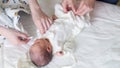 Newborn baby, mother and nurse - swaddling the infant Royalty Free Stock Photo