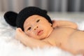 Newborn baby in mouse costume on fur bed Royalty Free Stock Photo