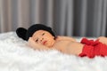 Newborn baby in mouse costume on fur bed Royalty Free Stock Photo