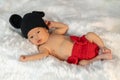 Newborn baby in mouse costume on fur bed Royalty Free Stock Photo