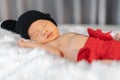 Newborn baby in mouse costume sleeping on fur bed Royalty Free Stock Photo