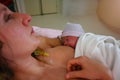 Newborn baby in mother& x27;s hands after giving birth Royalty Free Stock Photo