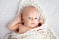 Newborn baby with open eyes. Portrait of pretty newborn boy 20 days old