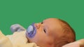 Newborn baby with papilla green screen dolly shot