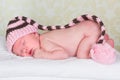 Newborn baby with pompom hat Royalty Free Stock Photo