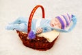 A newborn baby in purple knitted cap Royalty Free Stock Photo