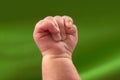 Newborn baby`s hand clenched into a fist Royalty Free Stock Photo