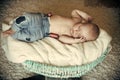 Newborn baby sleep in crib on floor Royalty Free Stock Photo