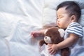 Newborn baby sleep with teddy bear Royalty Free Stock Photo