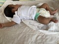 Newborn baby sleeping on a bed at home Royalty Free Stock Photo