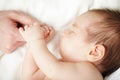 Newborn baby sleeping and holding father`s hand Royalty Free Stock Photo