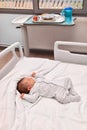 Newborn baby sleeping in the hospital bed Royalty Free Stock Photo