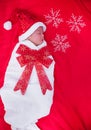 Newborn baby sleeping on santa het and red background Royalty Free Stock Photo