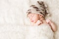 Newborn, baby sleeping in white bed, beautiful new born infant portrait Royalty Free Stock Photo