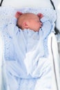 Newborn baby sleeping in white stroller Royalty Free Stock Photo