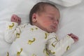 Newborn baby sleeps peacefully in the maternity hospital