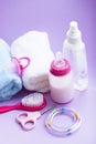 Newborn baby story. Towels and children's toys, scissors, baby bottle, nipple, hairbrush on white background Royalty Free Stock Photo