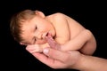 Newborn baby sucking on toe Royalty Free Stock Photo