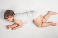 Newborn baby sweet sleeping on a white bed