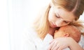 Newborn baby in tender embrace of mother Royalty Free Stock Photo