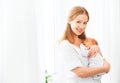 Newborn baby in tender embrace of mother Royalty Free Stock Photo