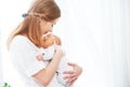 Newborn baby in tender embrace of mother Royalty Free Stock Photo